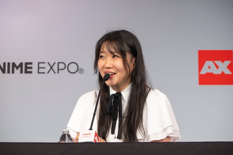 Emirichu talking to an audience.