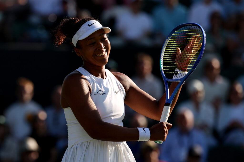 Naomi Osaka celebrates after defeating Katerina Siniakova at Wimbledon.