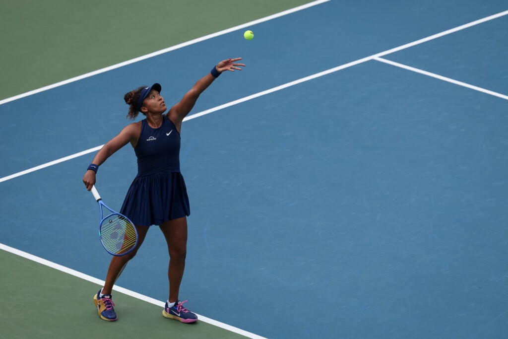 Naomi Osaka hits a serve against Emma Raducanu at the Mubadala Citi DC Open 2025