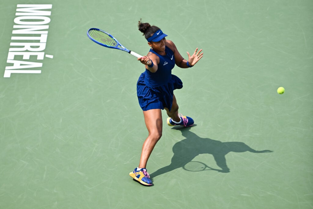 Naomi Osaka slides to retrieve a ball at the 2025 WTA 1000 National Bank Open presented by Rogers