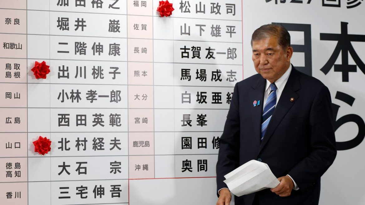 Japanese Prime Minister Shigeru Ishiba’s coalition loses Upper House majority | World News Shigeru Ishiba, Japan's Prime Minister and president of the ruling Liberal Democratic Party (LDP), walks before a board with few red paper roses showing elected candidate at the LDP headquarters in Tokyo, Sunday, July 20, 2025