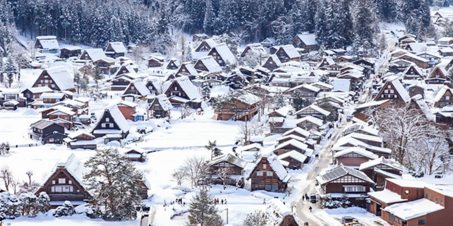 Shirakawa-go in the wintertime with snow-capped farmhouses
