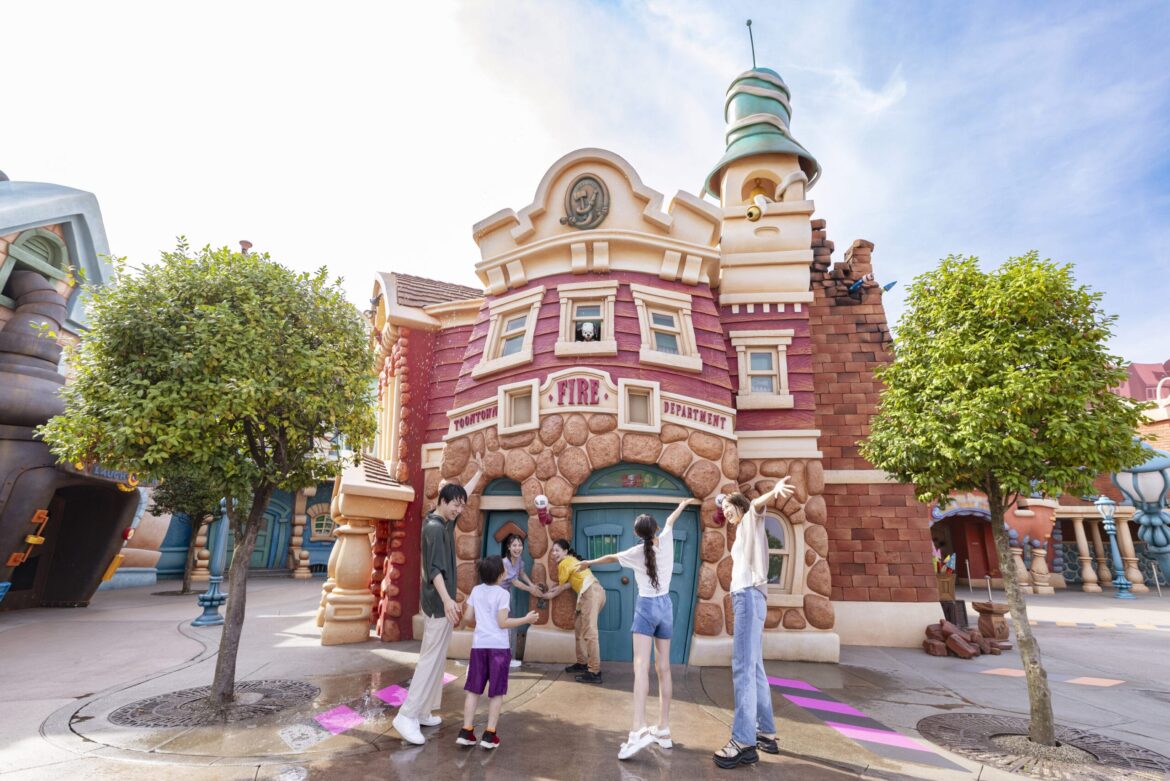 Summer Cool-Off ‘Get Soaked’ Offerings Now Available at Tokyo Disney Resort A colorful, decorated fence stands in front of ornate European-style buildings on an empty, stone-paved plaza.
