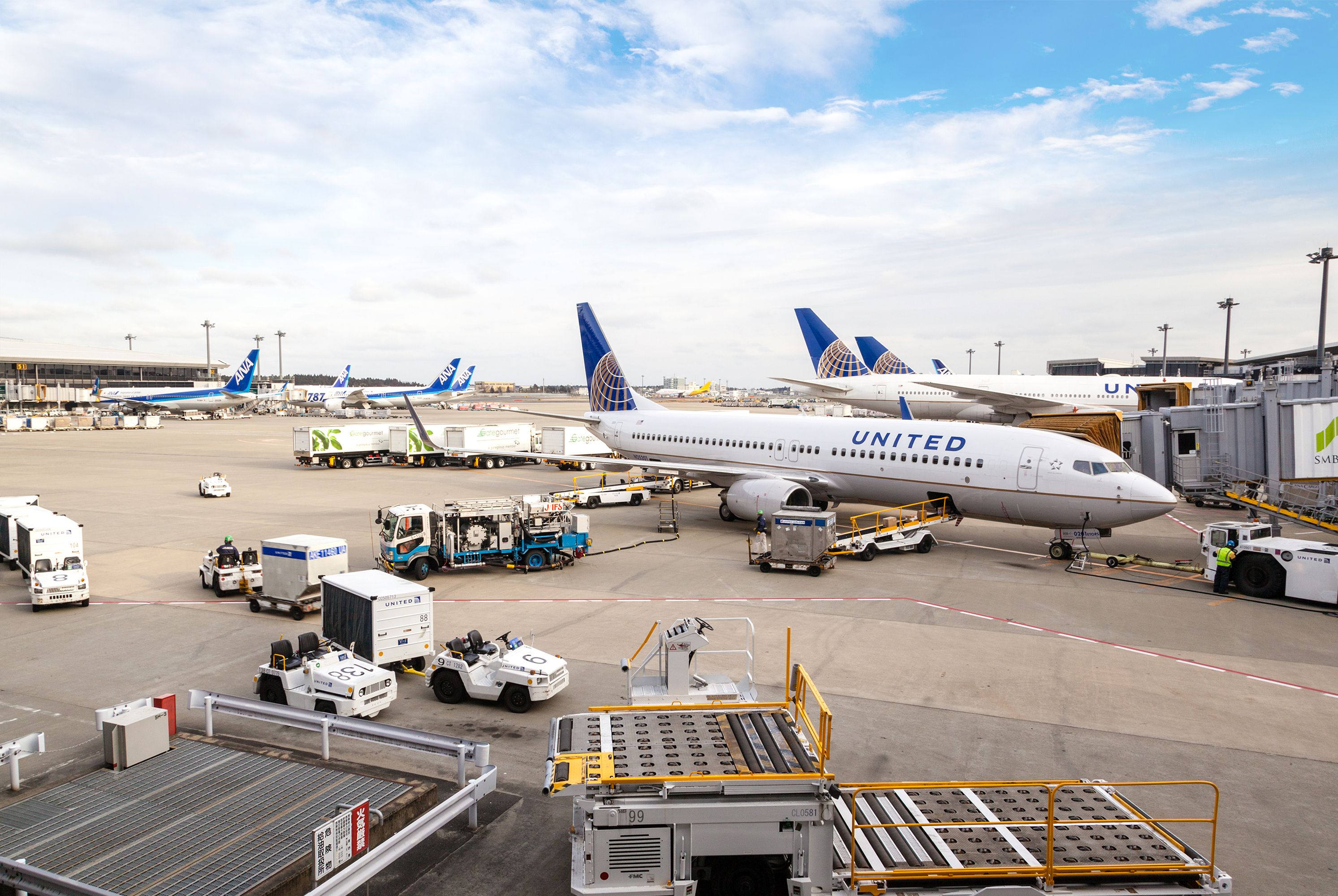 A fleet of United Airlines planes being serviced on the tarmac of Narita Airport Mar. 6, 2015.