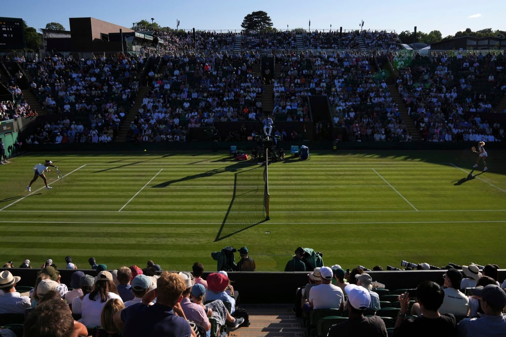 Naomi Osaka (left) serves to Katerina Siniakova during their second round women’s single match at Wimbledon. Photo: AP