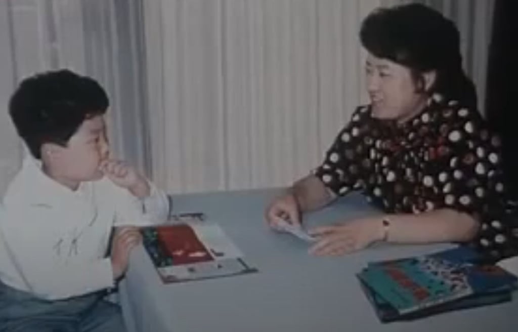 Ko Yong-hui with a young Kim Jong-un in a North Korean documentary. Photo: Yoji Gomi