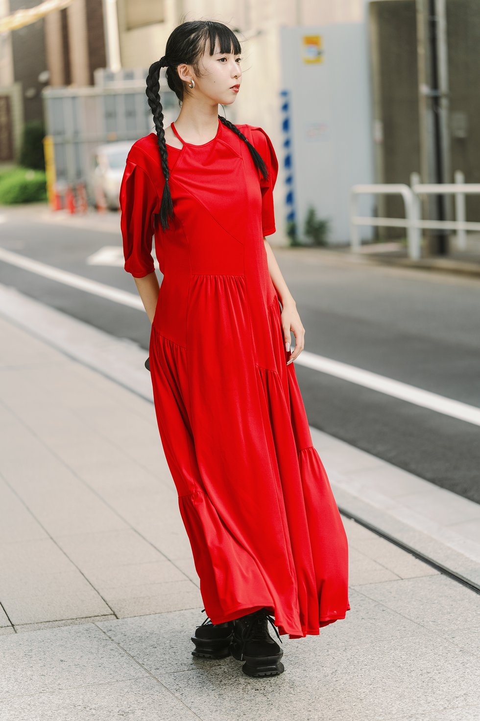 tokyo, japan september 07: a guest is seen wearing red maxi dress, black boots during rakuten tokyo fashion week s/s 2025 on september 07, 2024 in tokyo, japan. (photo by mila gruber/getty images)