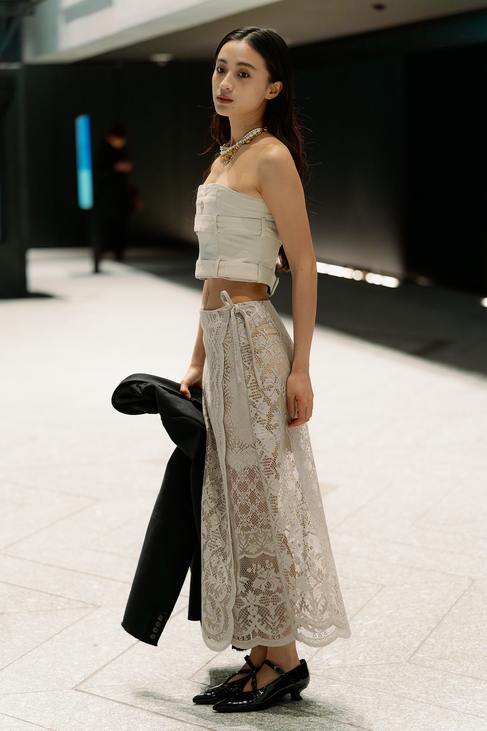 tokyo, japan march 19: a guest is seen wearing a beige top, beige maxi lace skirt, black shoes during rakuten tokyo fashion week a/w 2025 on march 19, 2025 in tokyo, japan. (photo by mila gruber/getty images)