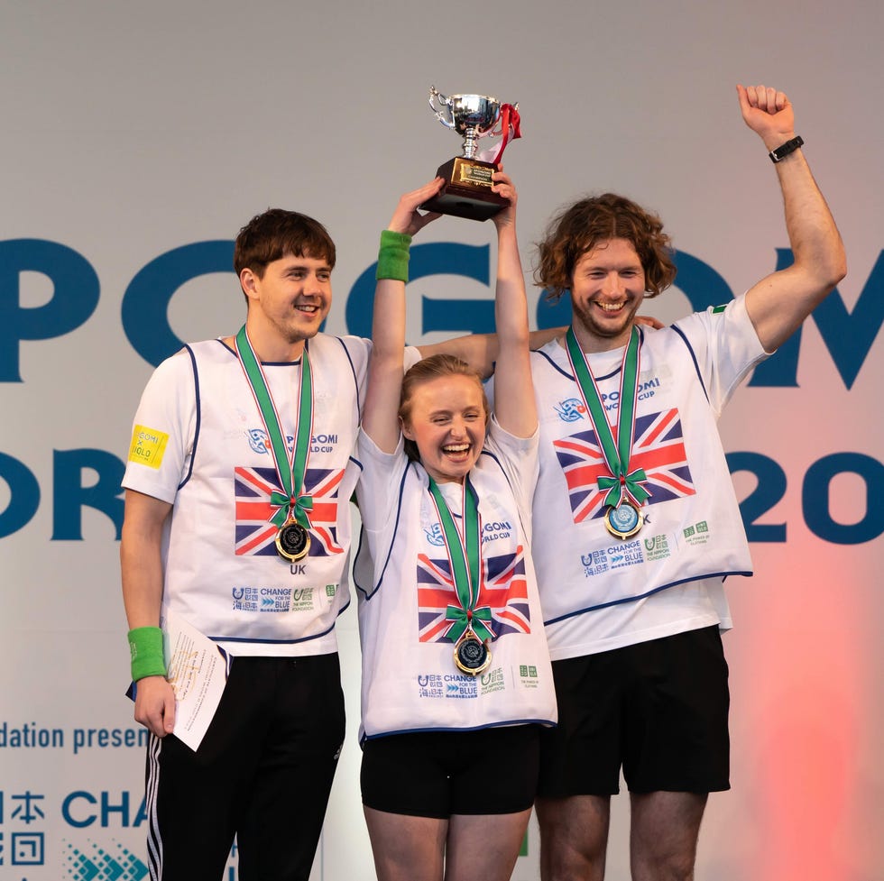 tokyo, japan november 22: members of the u.k. team pose with the trophy after winning the final stage of the spogomi world cup 2023 on november 22, 2023, in tokyo, japan. representatives from 21 countries gathered for the world cup where teams consisting of three people compete for points awarded based on the quantity and type of trash picked up in a designated area of tokyo's shibuya ward within a one hour time limit. (photo by tomohiro ohsumi/getty images)