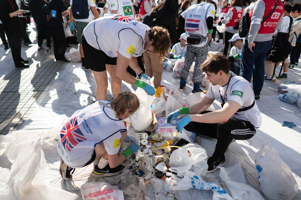 tokyo, japan november 22: members of the u.k. team sort rubbish during the final stage of the spogomi world cup 2023 on november 22, 2023, in tokyo, japan. representatives from 21 countries gathered for the world cup where teams consisting of three people compete for points awarded based on the quantity and type of trash picked up in a designated area of tokyo's shibuya ward within a one hour time limit. (photo by tomohiro ohsumi/getty images)