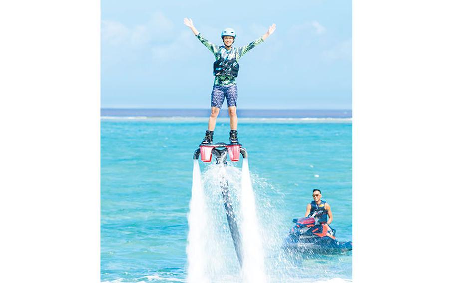 a women hovering in the air on a Flyboard