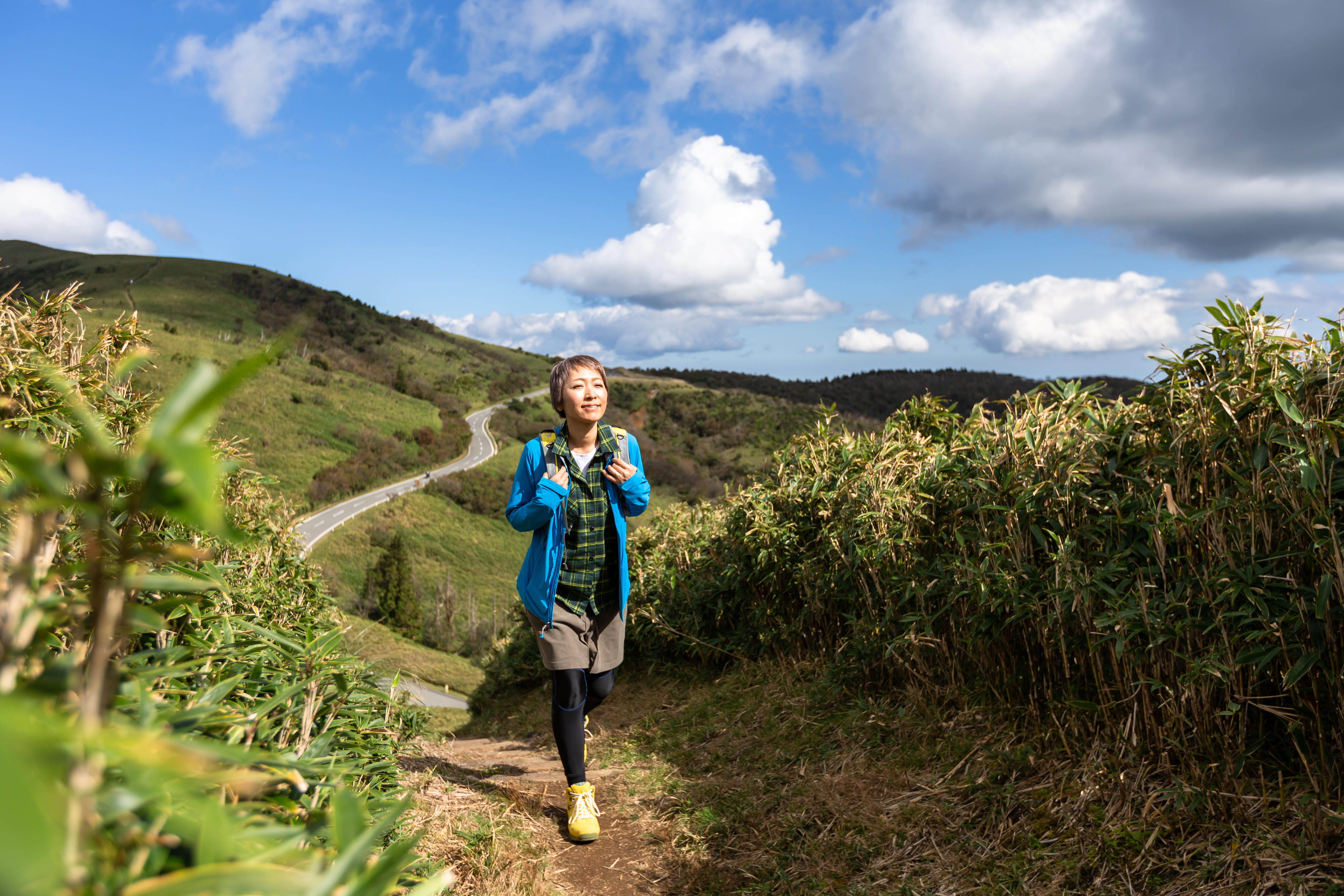 Woman hiking in mountains.