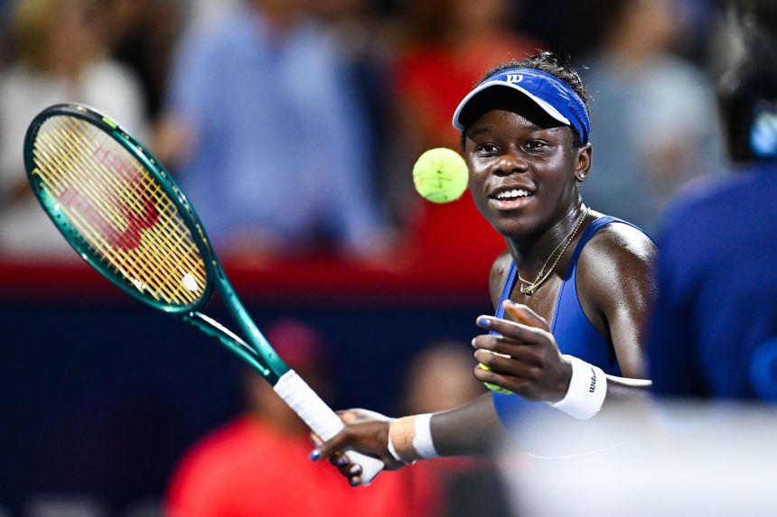 Mboko hits a ball to the fans as she celebrates her semifinal victory to reach her first WTA Tour final.