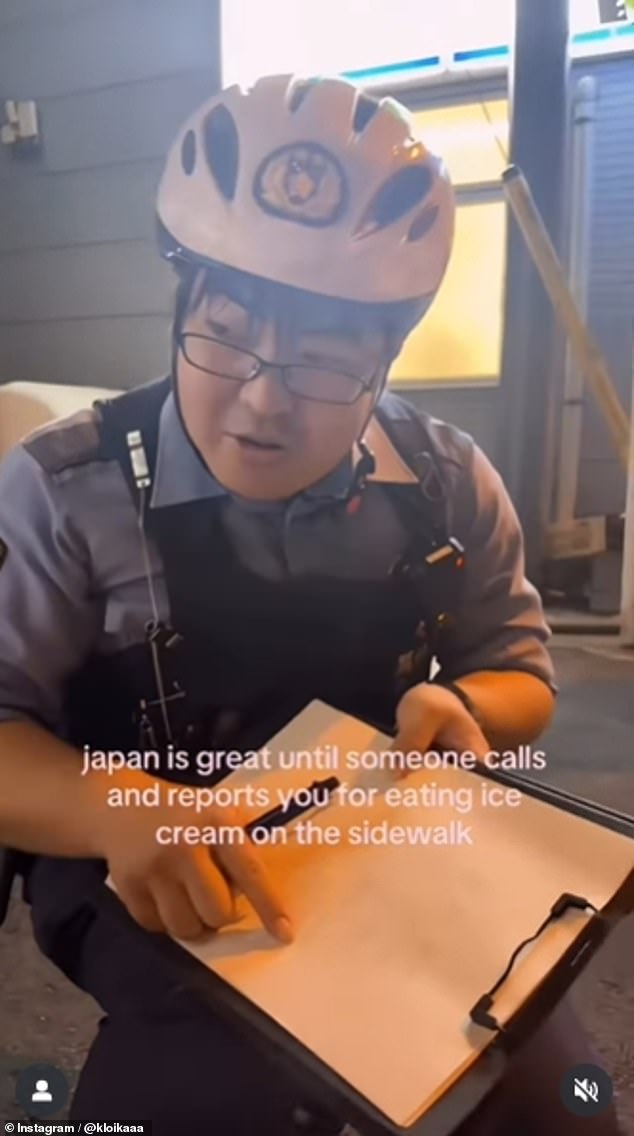 Though the audio had been disabled in the clip, a police officer can be visibly seen giving the tourist a stern scolding as he pointed to paperwork and proceeded to write her up