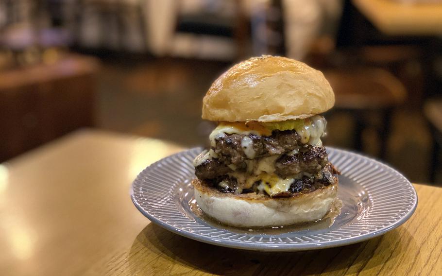 The Triple Cheeseburger from Two Brits Burger Bar in Tokyo is as excessive and satisfying as it sounds. 