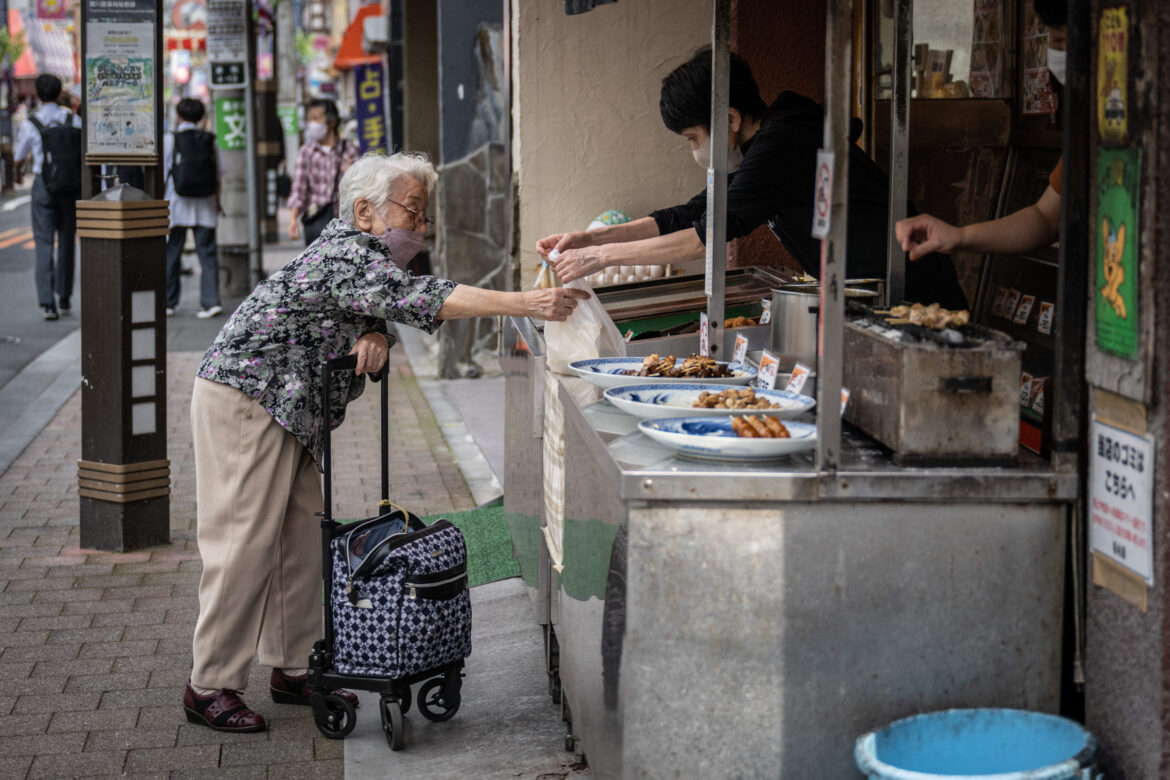 Japan Issues Update on Population ‘Emergency’ Woman Buys Chicken in Tokyo
