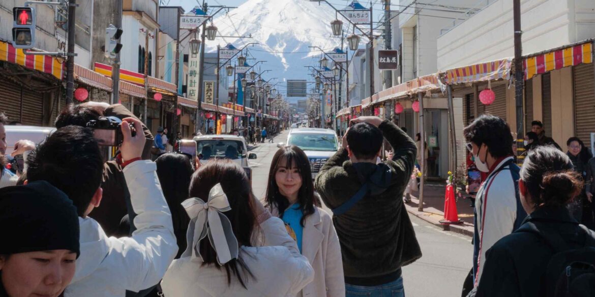 Asian tourists flock to Mount Fuji for the perfect shot