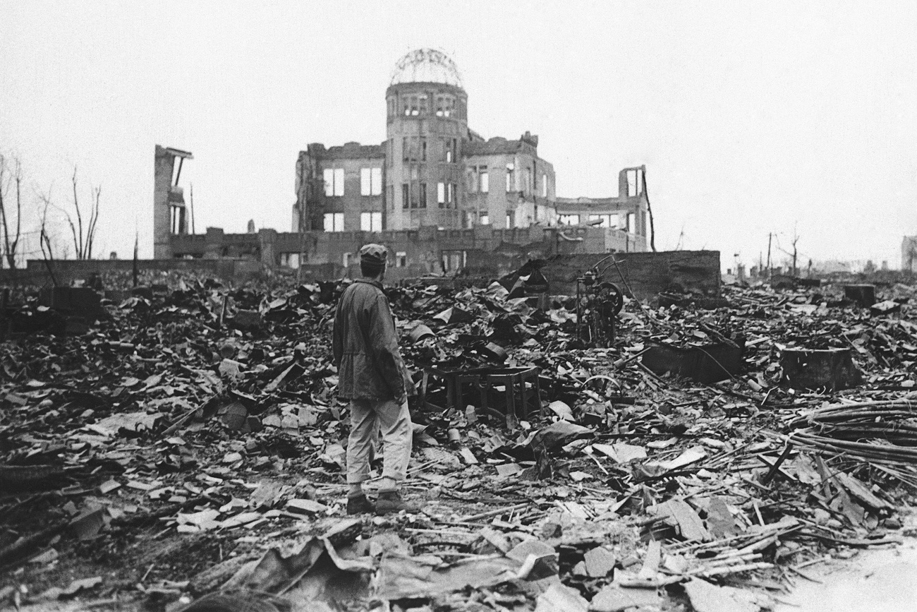 man standing in ruins
