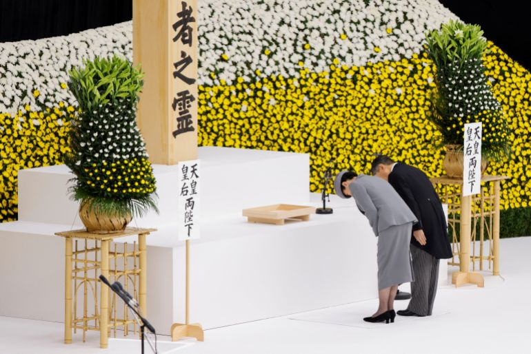 Japan's Emperor Naruhito and Empress Masako bow during a memorial service ceremony marking the 80th anniversary of Japan's surrender in World War Two, at Budokan Hall, in Tokyo, Japan, August 15, 2025. REUTERS/Manami Yamada