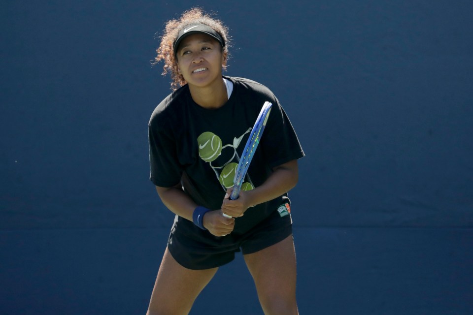 Naomi Osaka practicing tennis.