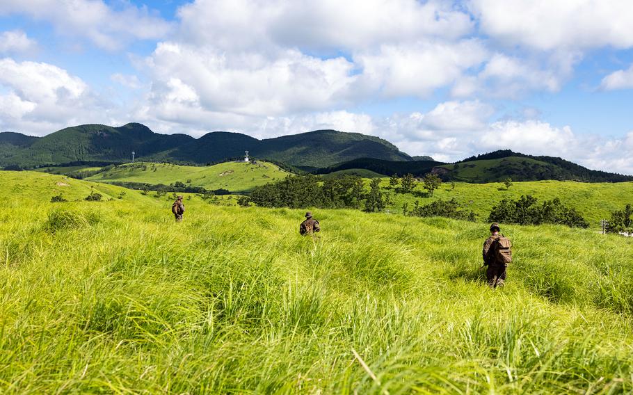 U.S. Marines train in a field in Japan.