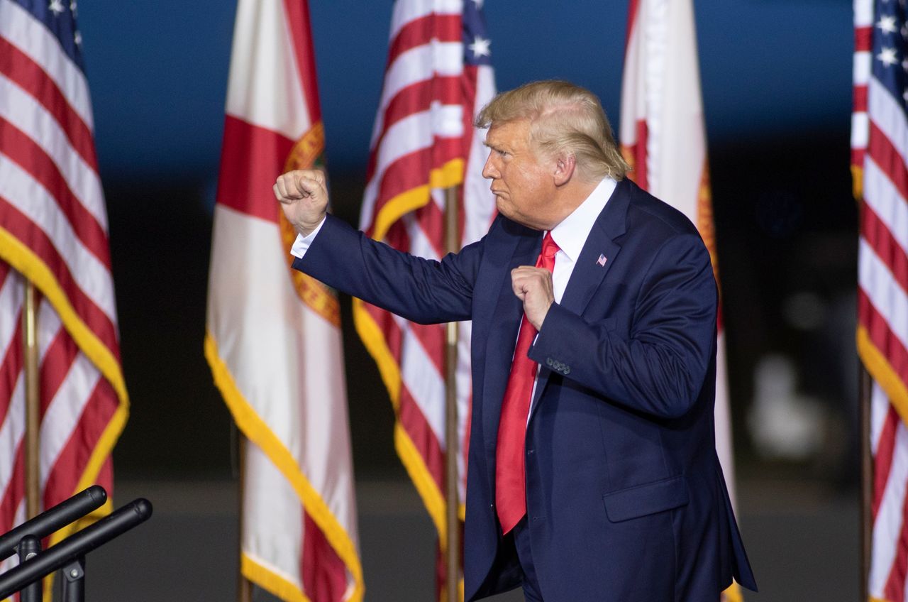 Trump celebrates at a campaign rally. (© USA Today Network via Reuters Connect)