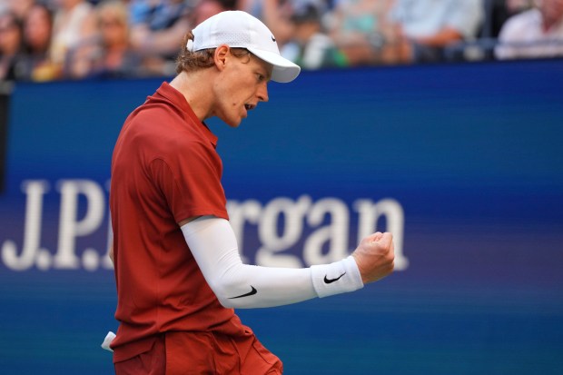 Jannik Sinner, of Italy, reacts to a shot against Denis...