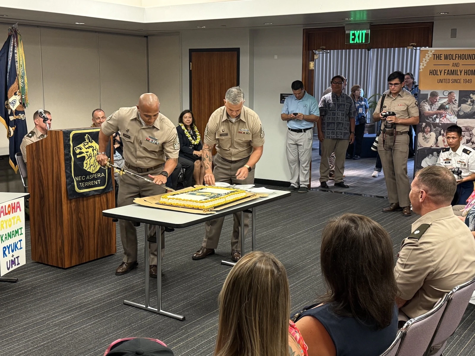 Wolfhounds cut cake for 11-year-olds Umi, Kanami, Ryota and Ryuki, at a ceremony Monday, Aug. 18, welcoming them to Hawai'i for two weeks. The children will be staying with military host families and experiencing culture and attractions on Oʻahu.