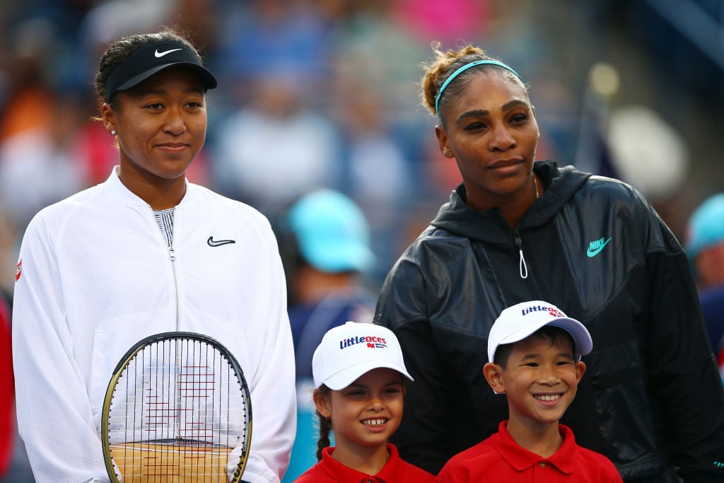 Serena Williams and Naomi Osaka pose for photos before their match at the 2019 Rogers Cup Toronto
