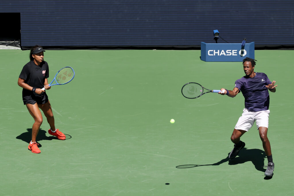 Gael Monfils hits a forehand alongside Naomi Osaka at the 2025 US Open - Mixed Doubles