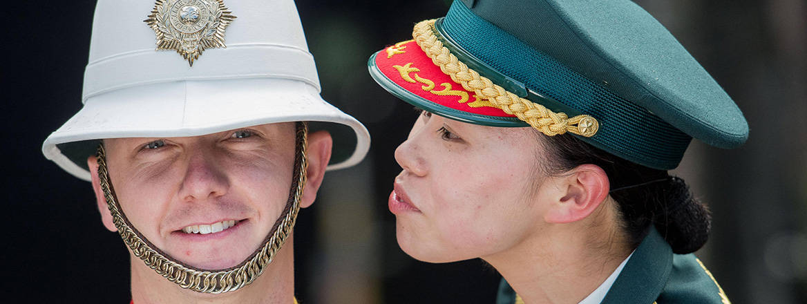 Sergeant Ayami Nakama of the Japanese Defense Force band and Jason Morris of the Royal Marine Band together at the Royal Edinburgh Military Tattoo.
