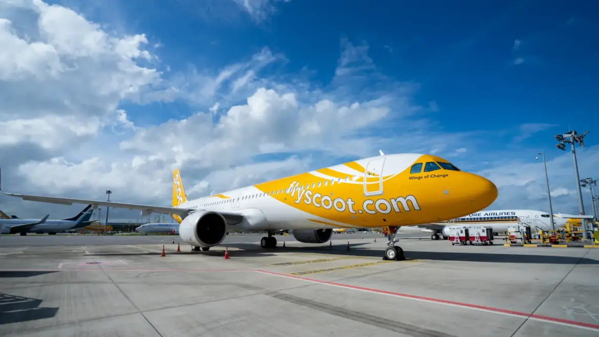 Scoot launches new flight services with yellow-and-white aircraft at airport tarmac