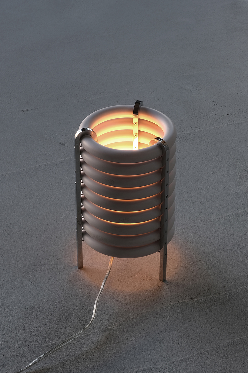wa upcycled table lamp by akasaki & vanhuyse is crafted from retired tokyo train parts