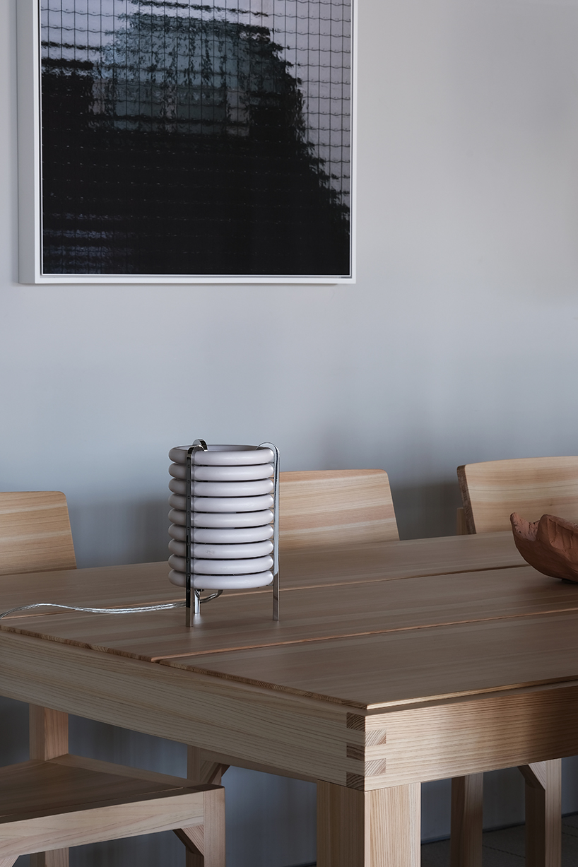 wa upcycled table lamp by akasaki & vanhuyse is crafted from retired tokyo train parts