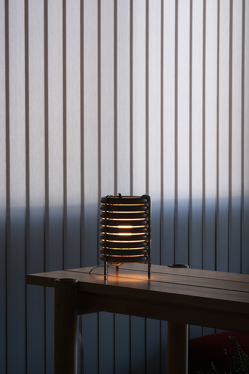 wa upcycled table lamp by akasaki & vanhuyse is crafted from retired tokyo train parts
