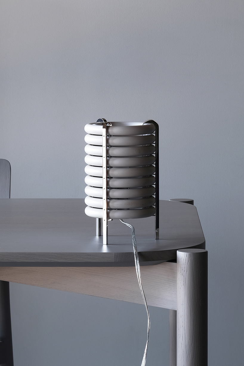 wa upcycled table lamp by akasaki & vanhuyse is crafted from retired tokyo train parts