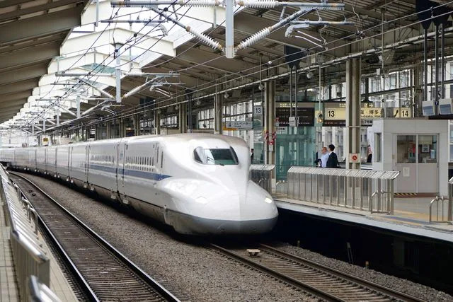 Jacob Jung/Getty Images 700 series Shinkansen bullet train pulling into Kyoto Station.