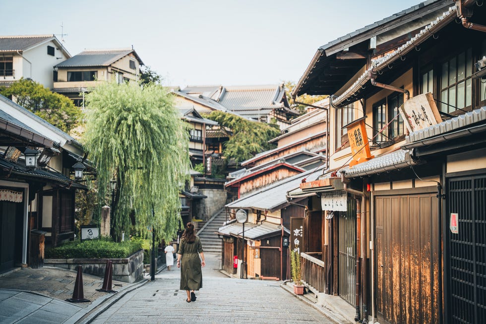 kyoto, tourist walking in alley in old town, gion. japan
