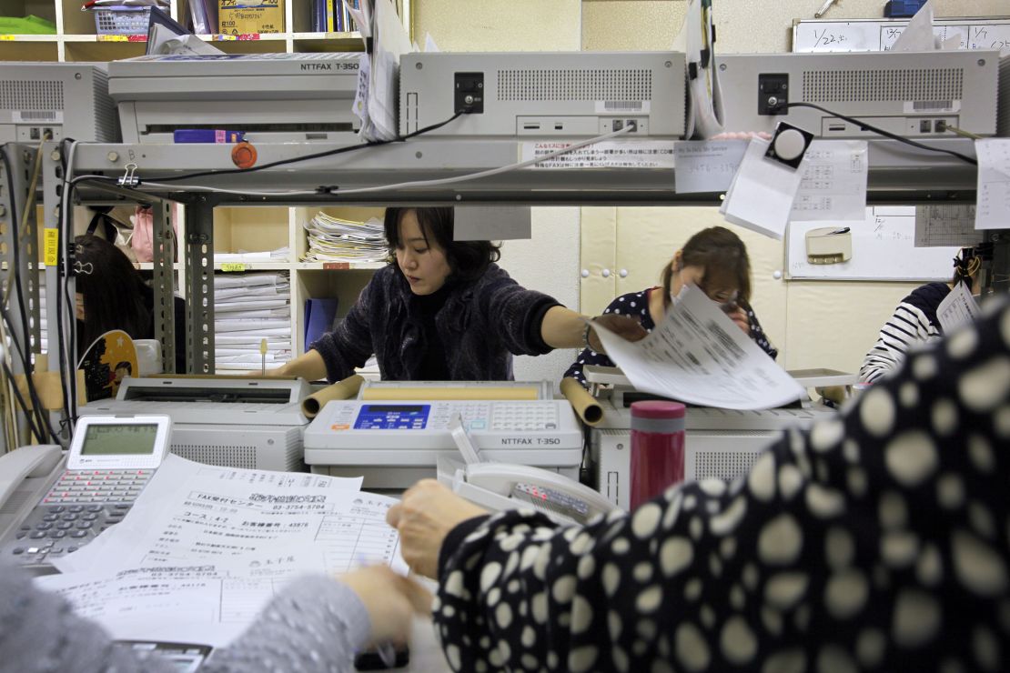 Employees at Tamagoya, a company that delivers traditional 