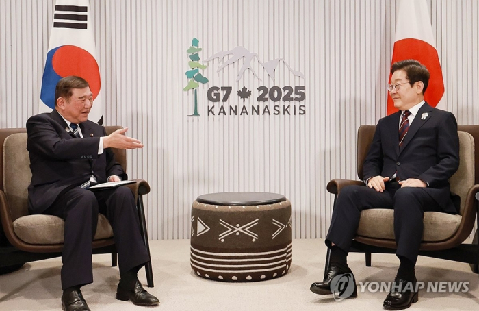 President Lee Jae Myung (right) meets with Japanese Prime Minister Shigeru Ishiba on the sidelines of the G7 Summit in Kananaskis, Alberta, on June 17, 2025