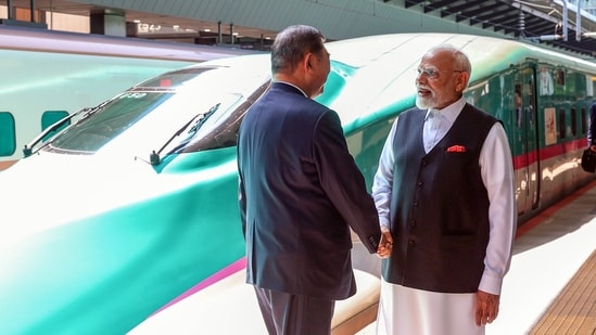 Prime Minister Narendra Modi greets Japan Prime Minister Shigeru Ishiba as the latter accompanies him on a trip in a Shinkansen bullet train from Tokyo to Sendai(PMO/ANI)