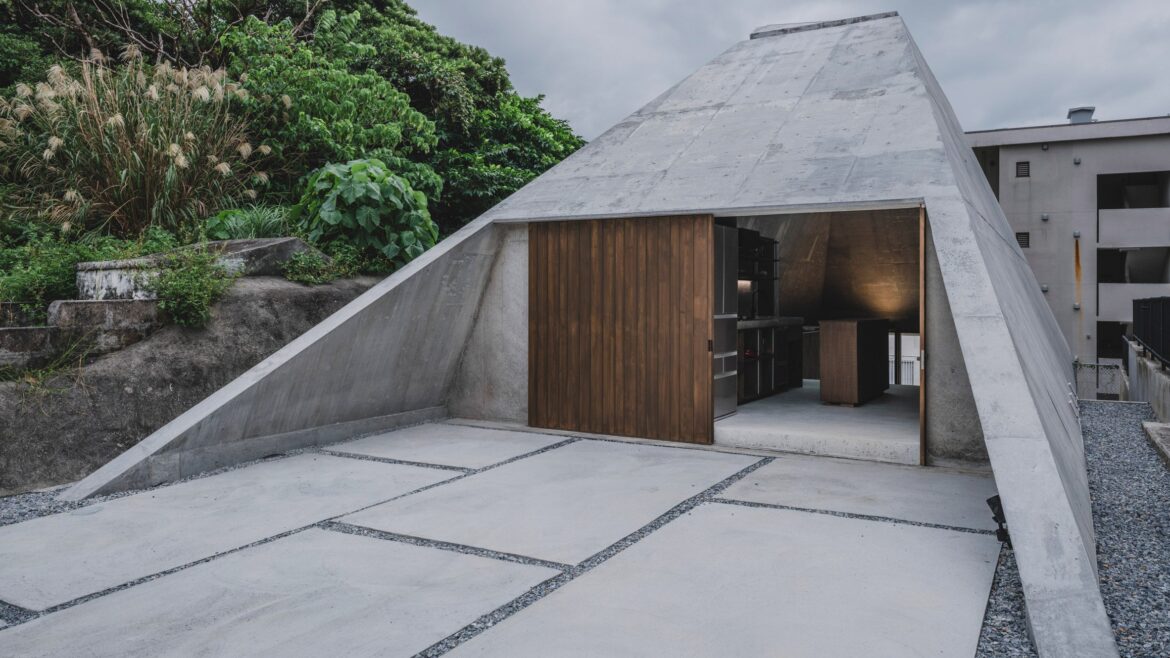 IGArchitects adds pyramidal concrete home to sloping site in Okinawa IGArchitects adds pyramidal concrete home to sloping site in Okinawa