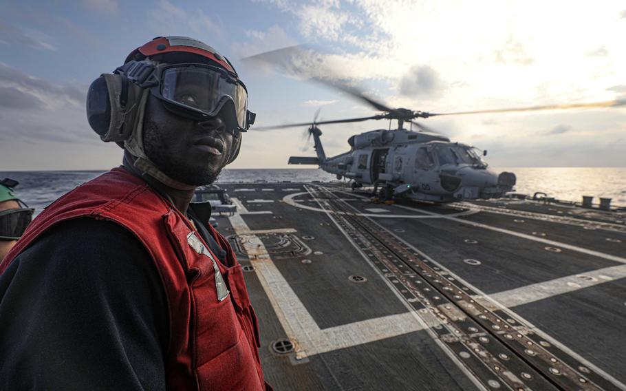 A U.S. Navy sailor stands watch on the flight deck of the guided-missile destroyer USS Dewey during the Freedom Edge exercise in waters between South Korea and Japan, Nov. 14, 2024. 