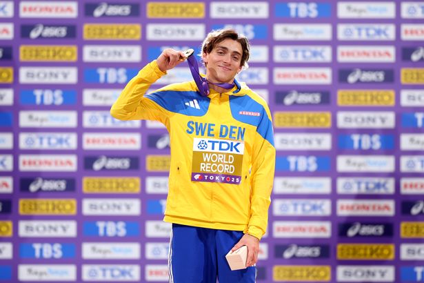 Gold medalist Armand Duplantis of Team Sweden celebrates on the podium whilst wearing a sign reading "WORLD RECORD" after setting a new world record of 6.30 Metres during the Men's Pole Vault medal ceremony on day four of the World Athletics Championships Tokyo 2025 at National Stadium on September 16, 2025 in Tokyo, Japan. 