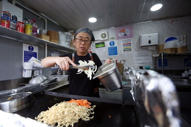 Sachi Kotake cooking yaki soba (stir fried noodles)