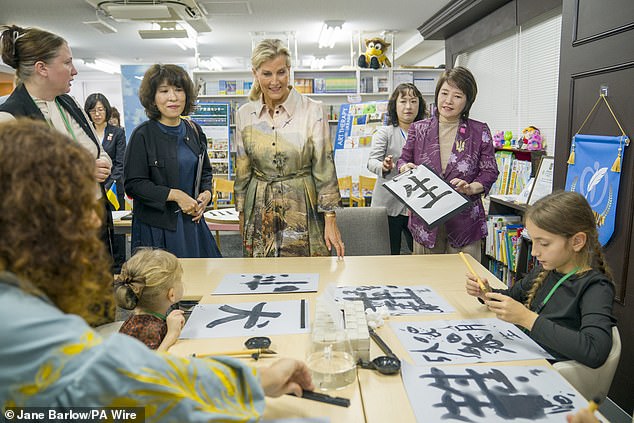 Sophie was photographed engaging with people taking part in a calligraphy language workshop at the Ukraine Mental Health Exchange Center in Tokyo