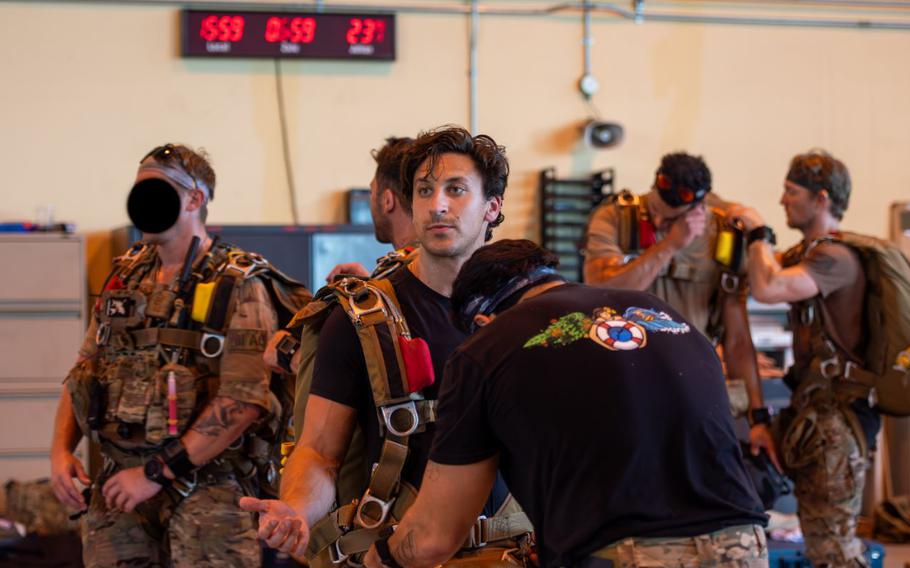 U.S. Air Force Staff Sgt. Eric Gershman, 31st Rescue Squadron pararescuemen, gets inspected by a jumpmaster at Yokota Air Base, Japan, Aug. 25, 2025. 