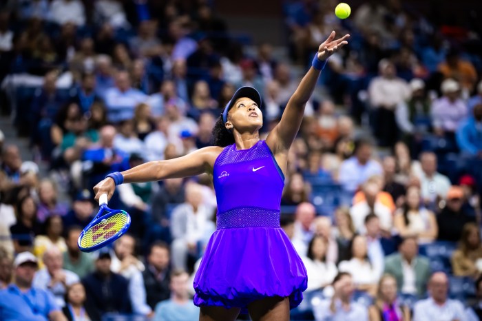 Naomi Osaka is ready to hit the ball with her tennis racket