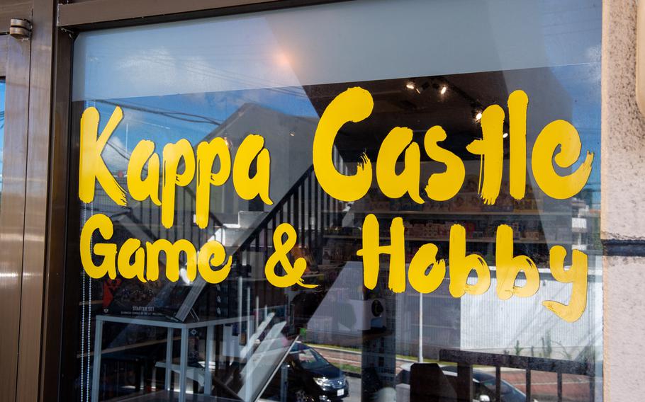 A storefront window reads the name Kappa Castle Game & Hobby in yellow stylized letters.