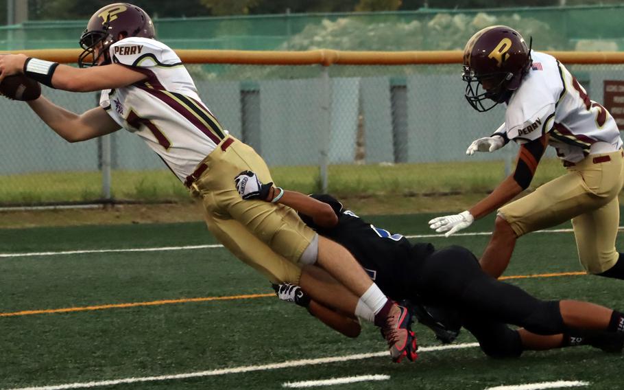 Kelton Clark dives for the end zone.